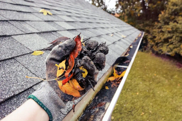 gutter being cleaned