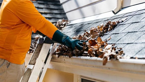 gutter being cleaned