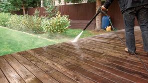wooden patio porch being pressured washed