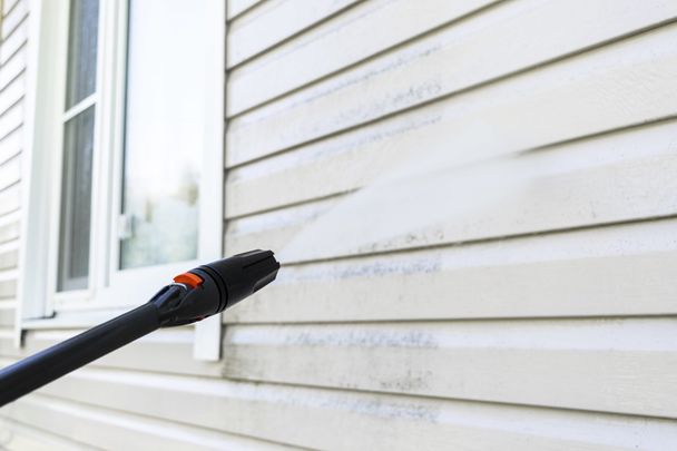 wooden patio porch being pressured washed