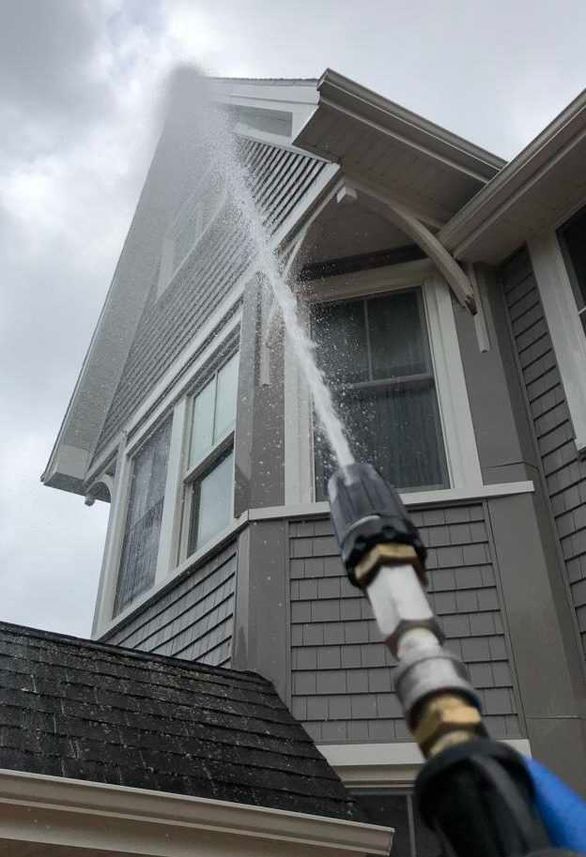 wooden patio porch being pressured washed